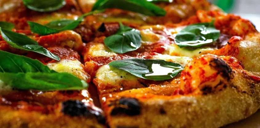 Pizza 64 Saddlepeace signature Butter Chicken Pizza - Indian fusion pizza in Calgary